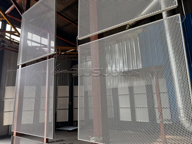 he sprayed aluminum perforated sheet product is hung on the shelf.