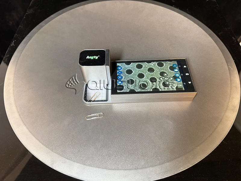 The hole of the laser micro-perforation plate is measured to be 0.3 mm.