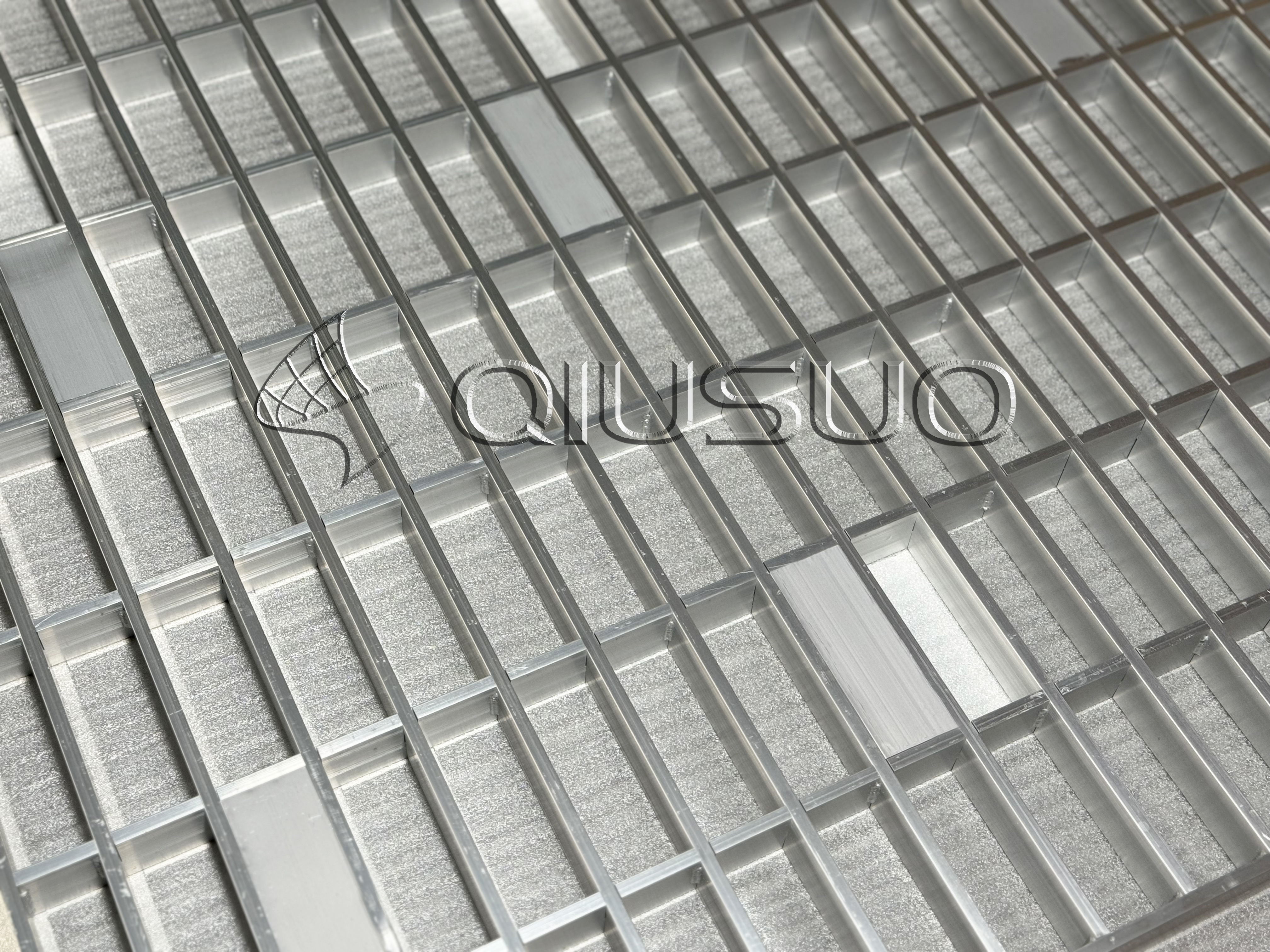 This is a close-up view picture of  6061 anodized aluminum bar grating.