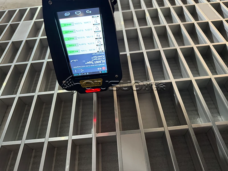 Test the material of aluminum bar grating with a tester.