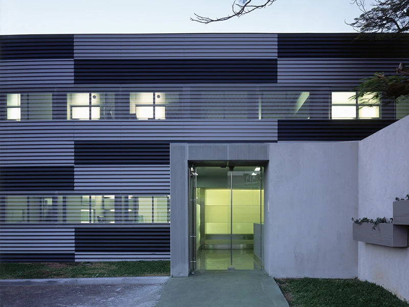 Exterior building facade of a restaurant using corrugated perforated metal panels