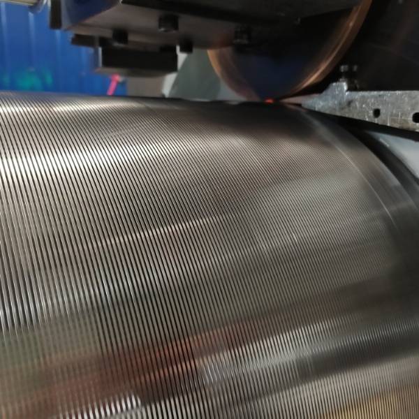 The resistance welding machine is welding the wedge wire screen