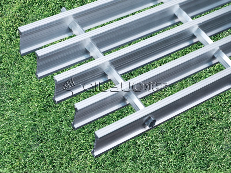 A aluminium swaged i metal bar grating placed at an angle