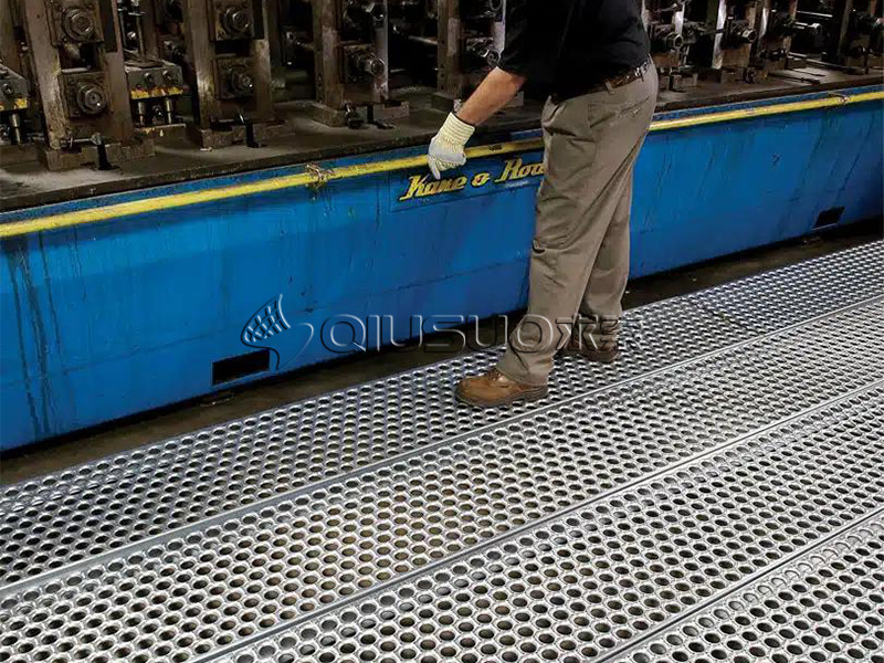 A worker is working on Perf-O grip plank safety grating platform.