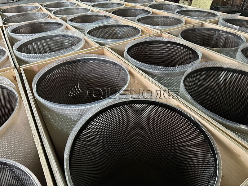 Neatly pack perforated metal mesh cylinders with plastic net sleeve in wooden boxes