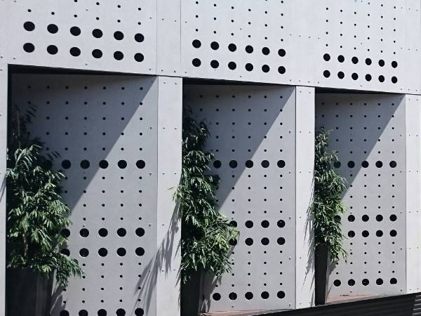 The exterior walls are decorated with perforated panels