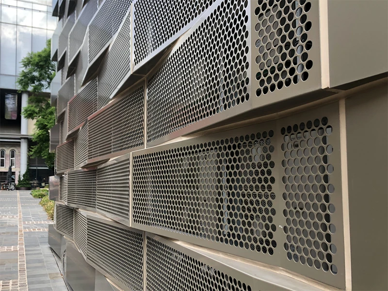Installed on the facade with staggered circular perforated plates