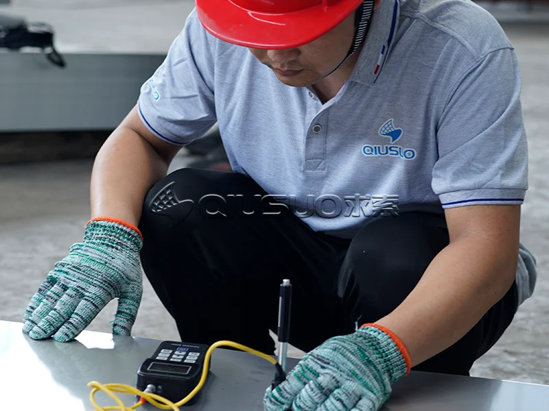 The worker is testing raw material hardness.