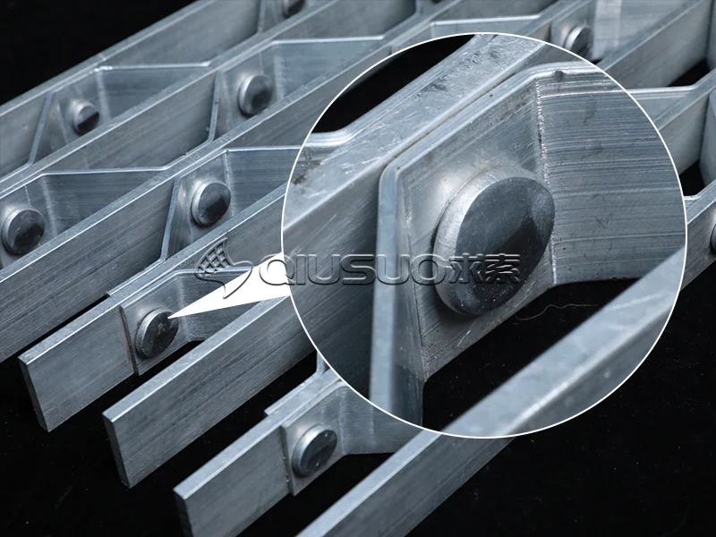 Detailed view of the rivet on a riveted bar aluminum bar grating