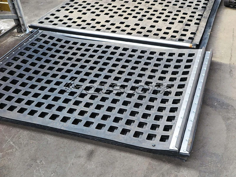 Newly manufactured rubber tension screens stacked on the ground