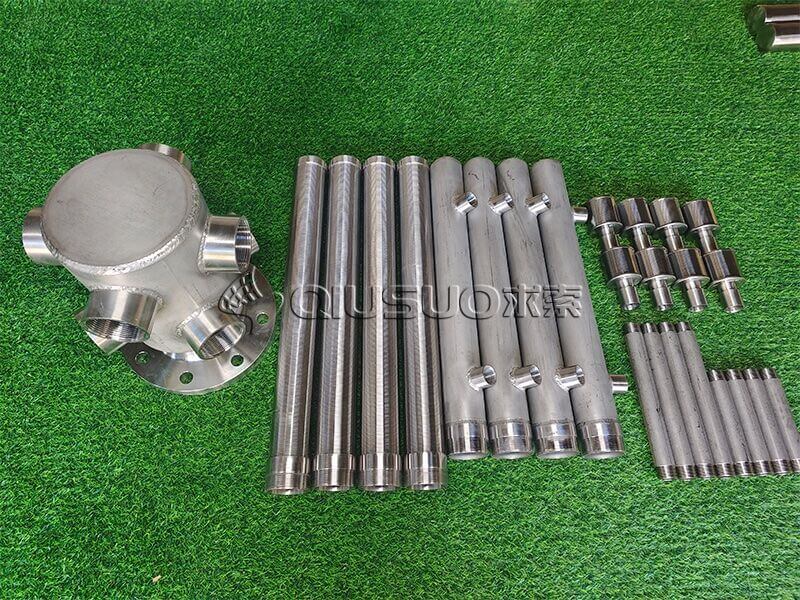 Wedge wire screen water distributor bottom collector elements on green carpet