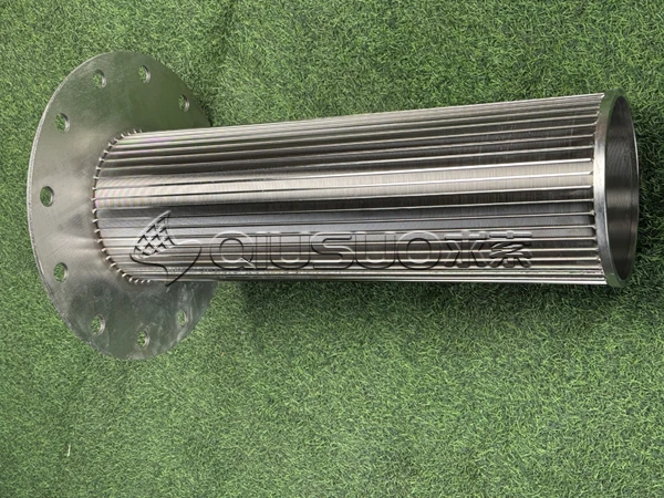 A finished wedge wire screen cylinder is placed on the green grass.