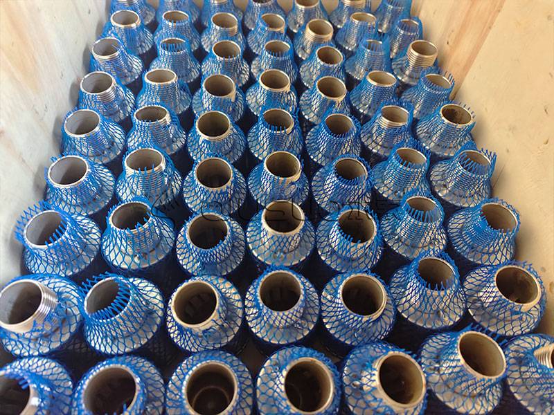 Many wedge wire screen nozzles in wooden carton